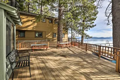 a wooden deck with benches and a house at Lakefront Cabin with Beach Access 8 Mi to Northstar in Tahoe Vista