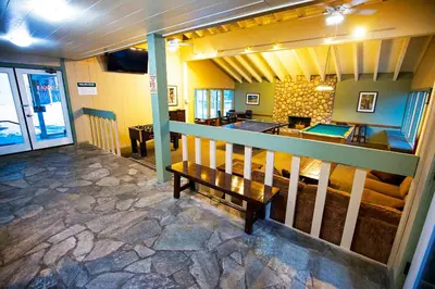 a room with a bench and a bar in a building at The Mammoth House in Mammoth Lakes