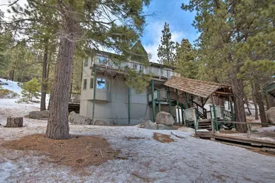 a house with a tree in front of it at Stateline Ski House Walk to Boulder Lift! in Stateline