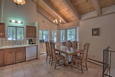 a kitchen with a dining room table and chairs at Stateline Ski House Walk to Boulder Lift! in Stateline