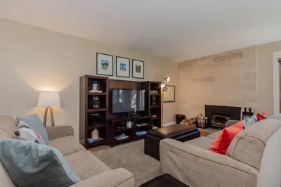 a living room with two couches and a television at Snowcreek I 33 in Mammoth Lakes