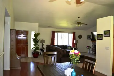 a living room with a couch and a table at Blue Jay Paradise in Three Rivers