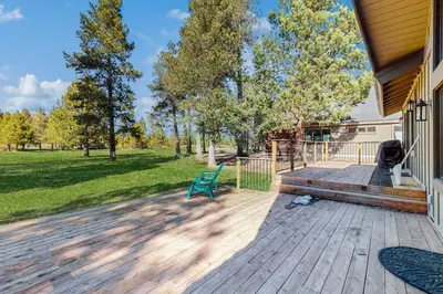 a deck with a green bench on a house at Country Club Retreat in South Lake Tahoe