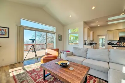 a living room with a couch and a table at Hot Tub and Mtn Views Peaceful Columbia Retreat! in Columbia