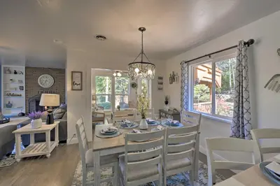 a dining room and living room with a table and chairs at Wine Lovers Garden Oasis in Sutter Creek! in Sutter Creek