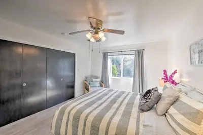 a bedroom with a bed and a ceiling fan at Wine Lovers Garden Oasis in Sutter Creek! in Sutter Creek