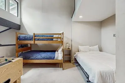 a room with two bunk beds and a bed at St. Moritz 13 in Mammoth Lakes