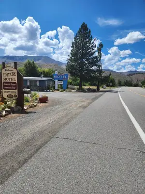 an empty road in front of a motel at Toiyabe Motel in Walker