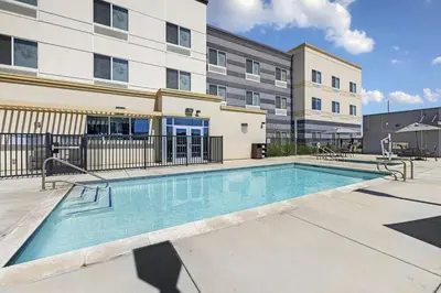 a swimming pool in front of a building at Fairfield Inn & Suites by Marriott Lodi in Lodi