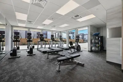 a gym with treadmills and exercise equipment in a building at Fairfield Inn & Suites by Marriott Lodi in Lodi