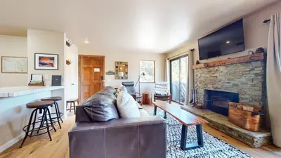 a living room with a couch and a fireplace at Hidden Valley #107 condo in Mammoth Lakes