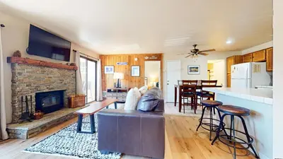 a living room with a couch and a fireplace at Hidden Valley #107 condo in Mammoth Lakes