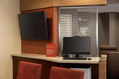 a computer sitting on a desk with a monitor at TownePlace Suites Fresno Clovis in Clovis