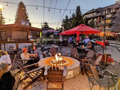 a group of people sitting around a fire pit in a patio at Marriott Grand Res Q4 #4256 in South Lake Tahoe