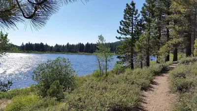 a trail next to a body of water with trees at Marriott Grand Res Q4 #4256 in South Lake Tahoe