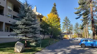 a blue car parked on a street next to a building at Lakeland Village #105 in South Lake Tahoe