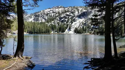 a view of a lake with a snow covered mountain at Lakeland Village #105 in South Lake Tahoe