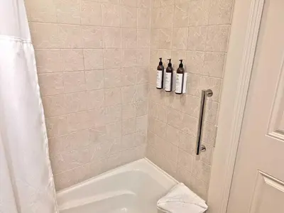 a bathroom with two bottles of wine in a shower at Marriott Grand Res Q3 #2241 in South Lake Tahoe