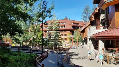 a group of people walking down a street next to a building at Marriott Grand Res Q3 #2241 in South Lake Tahoe