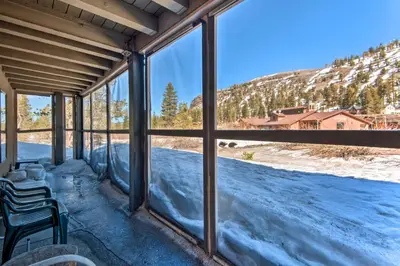a room with windows with a view of a mountain at Walk to Ski Lift and Village Lovely Kirkwood Condo! in Kirkwood