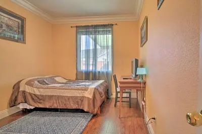 a bedroom with a bed and a desk and a window at Sacramento Area Apartment 15 Mi to Downtown in Antelope