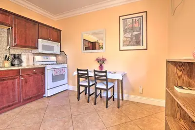 a kitchen with a table and chairs and a microwave at Sacramento Area Apartment 15 Mi to Downtown in Antelope