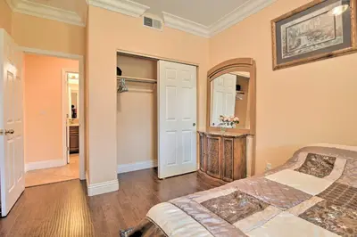 a bedroom with a bed and a mirror at Sacramento Area Apartment 15 Mi to Downtown in Antelope