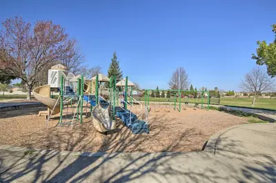 a playground with a slide in a park at Sacramento Area Apartment 15 Mi to Downtown in Antelope