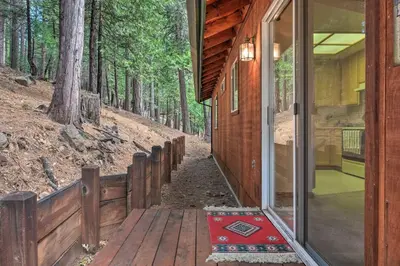 a porch of a house with a door open at 4 Mi to Big Tree State Park Serene Cabin with Deck in Arnold
