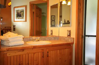 a bathroom with a sink and a mirror at Sierra Park Villas 23 in Mammoth Lakes