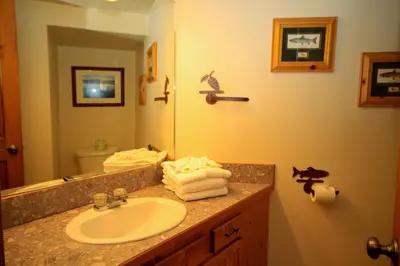 a bathroom with a sink and a mirror at Sierra Park Villas 23 in Mammoth Lakes