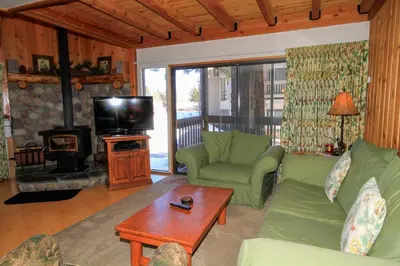 a living room with a couch and a fireplace at Sierra Park Villas 23 in Mammoth Lakes