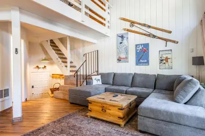 a living room with a couch and a table at Sierra Park Villas 04 in Mammoth Lakes