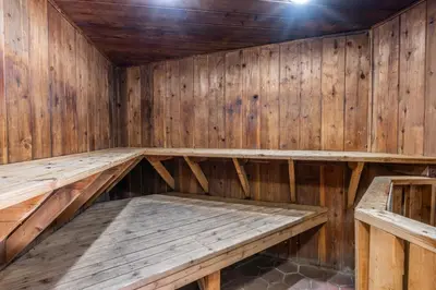 an empty sauna with wooden walls and ceilings at Sierra Park Villas 04 in Mammoth Lakes