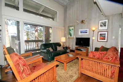 a living room with a couch and a tv at SIerra Park Villas #06 in Mammoth Lakes