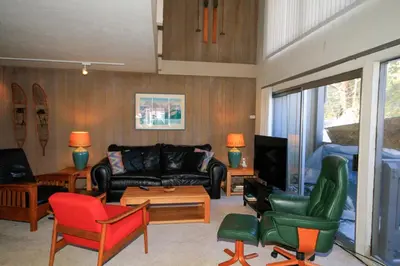 a living room with a couch and chairs at Sierra Park Villas 24 in Mammoth Lakes