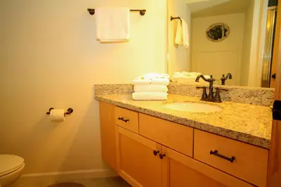 a bathroom with a sink and a mirror at Sierra Park Villas #82 in Mammoth Lakes
