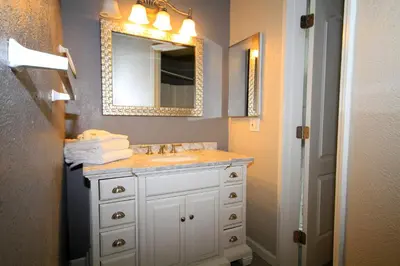 a bathroom with a sink and a mirror at Sierra Park Villas 65 in Mammoth Lakes