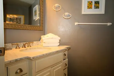 a bathroom with a sink and a mirror at Sierra Park Villas 65 in Mammoth Lakes