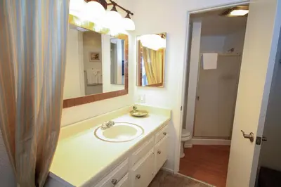 a bathroom with a sink and a mirror at Sierra Park Villas 89 in Mammoth Lakes