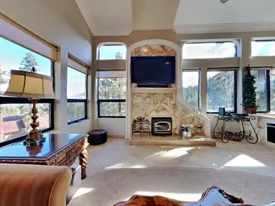 a living room with a fireplace and a tv at 623 home in Mammoth Lakes
