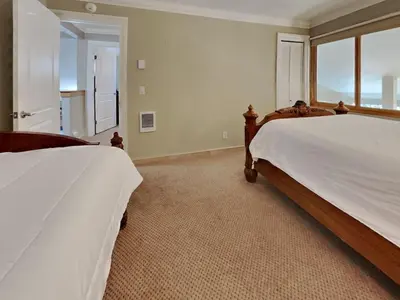 a bedroom with two beds and a large window at 623 home in Mammoth Lakes