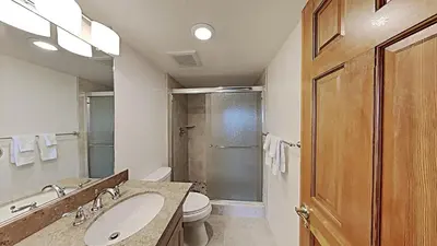 a bathroom with a sink and a toilet and a shower at Comfortable 2 BR Loft Slope View Condo! in Mammoth Lakes