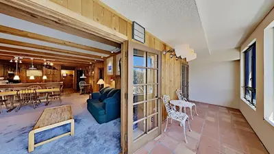 a living room with a couch and a table at Beautiful 2 Bedroom Condo with Mountain View! in Mammoth Lakes