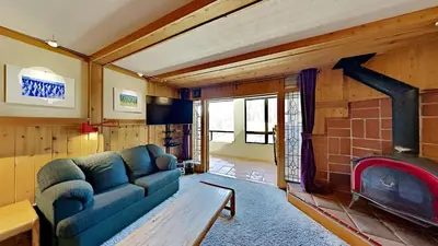 a living room with a couch and a fireplace at Beautiful 2 Bedroom Condo with Mountain View! in Mammoth Lakes