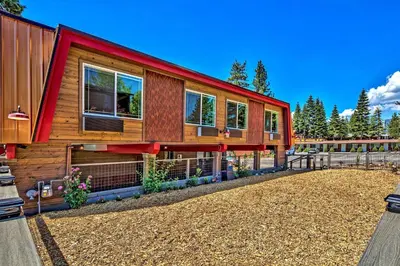 a house with a red roof with a yard at The Elet Hotel in South Lake Tahoe