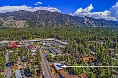an aerial view of a resort with mountains in the background at The Elet Hotel in South Lake Tahoe