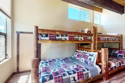 a bedroom with two bunk beds in a room at North Lake Loft in Kings Beach