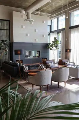 a living room with a couch and chairs and a table at Tapestry By Hilton The Fort Sutter Hotel Sacramento, Ca in Sacramento