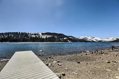 a dock on the shore of a lake with a bench at Tahoe Donner Retreat with Decks and Lake Access! in Truckee